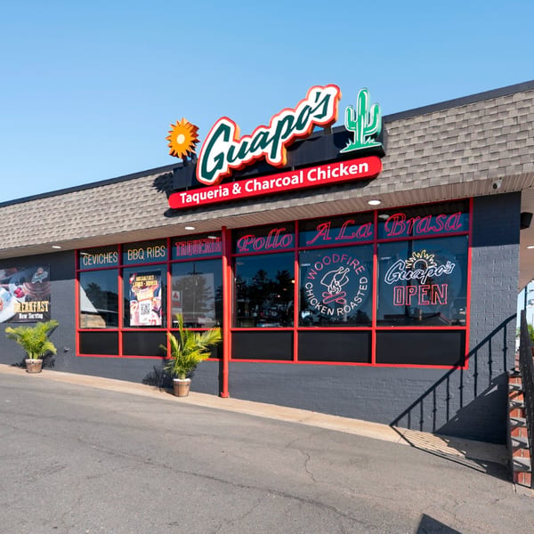 Exterior of Guapo's GO, a Tex-Mex restaurant, with its sign, windows, and entrance visible.